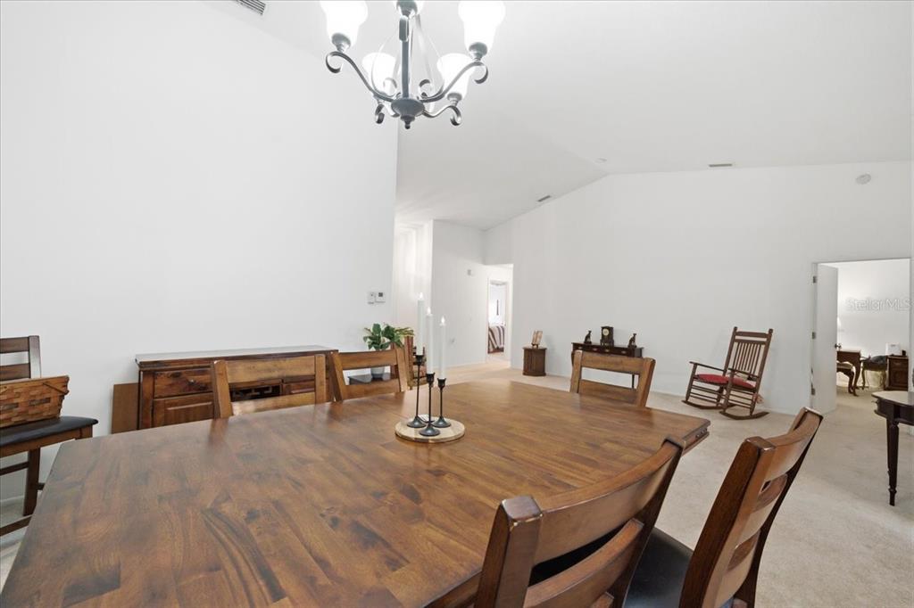 9338 Clearmeadow New Port Richey, FL 34655 - Photo 12 of 54 a view of a dining room with furniture