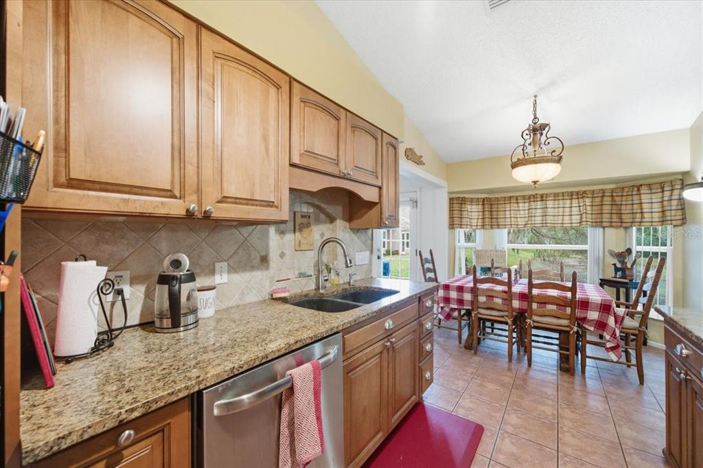 9338 Clearmeadow New Port Richey, FL 34655 - Photo 15 of 54 a kitchen with sink cabinets and outdoor view