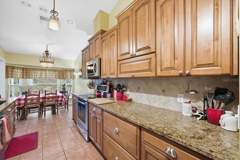 9338 Clearmeadow New Port Richey, FL 34655 - Photo 16 of 54 a kitchen with lots of counter top space