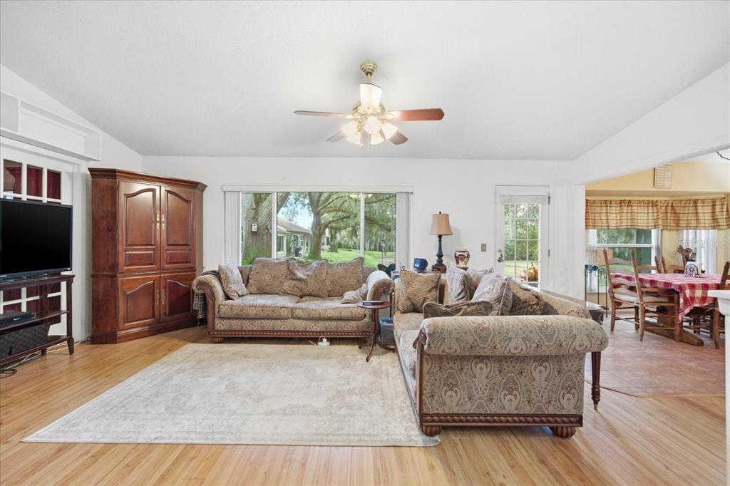 9338 Clearmeadow New Port Richey, FL 34655 - Photo 21 of 54 a living room with fireplace furniture and a flat screen tv