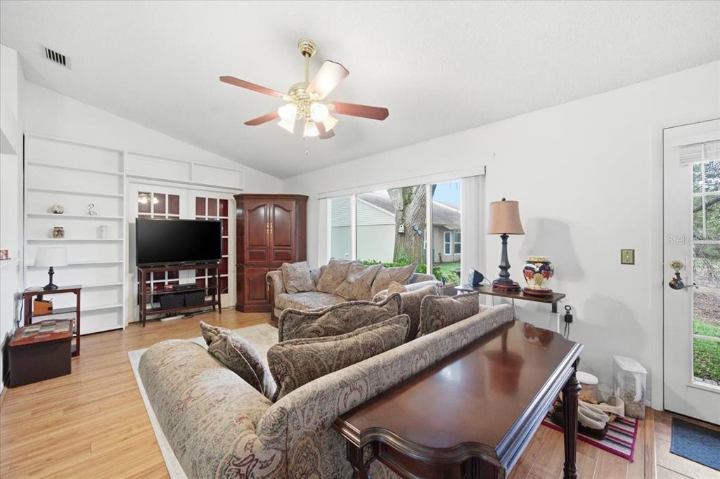 9338 Clearmeadow New Port Richey, FL 34655 - Photo 22 of 54 a living room with furniture and a flat screen tv