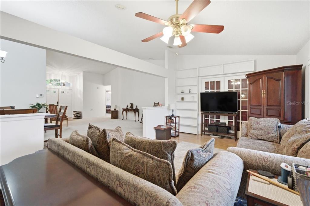 9338 Clearmeadow New Port Richey, FL 34655 - Photo 24 of 54 a living room with furniture and a flat screen tv