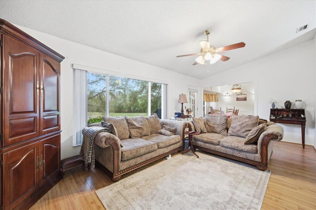 9338 Clearmeadow New Port Richey, FL 34655 - Photo 25 of 54 a living room with furniture and a large window
