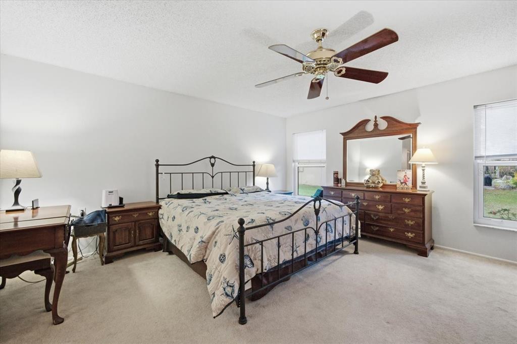 9338 Clearmeadow New Port Richey, FL 34655 - Photo 29 of 54 a bedroom with a bed and window