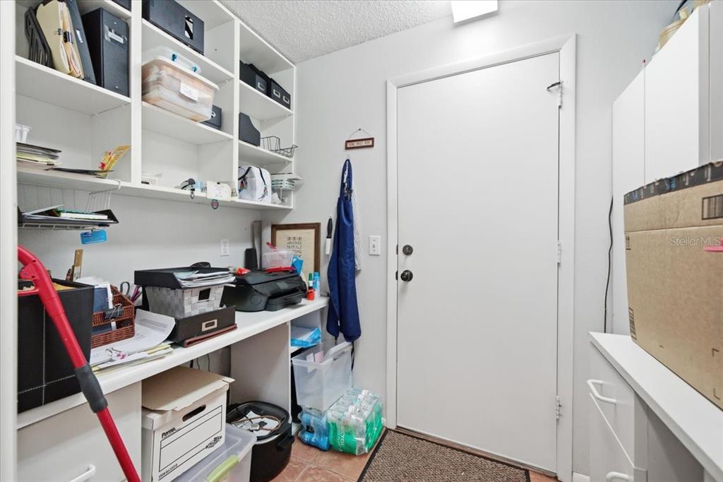 9338 Clearmeadow New Port Richey, FL 34655 - Photo 35 of 54 a view of walk in closet with clothes and shoes