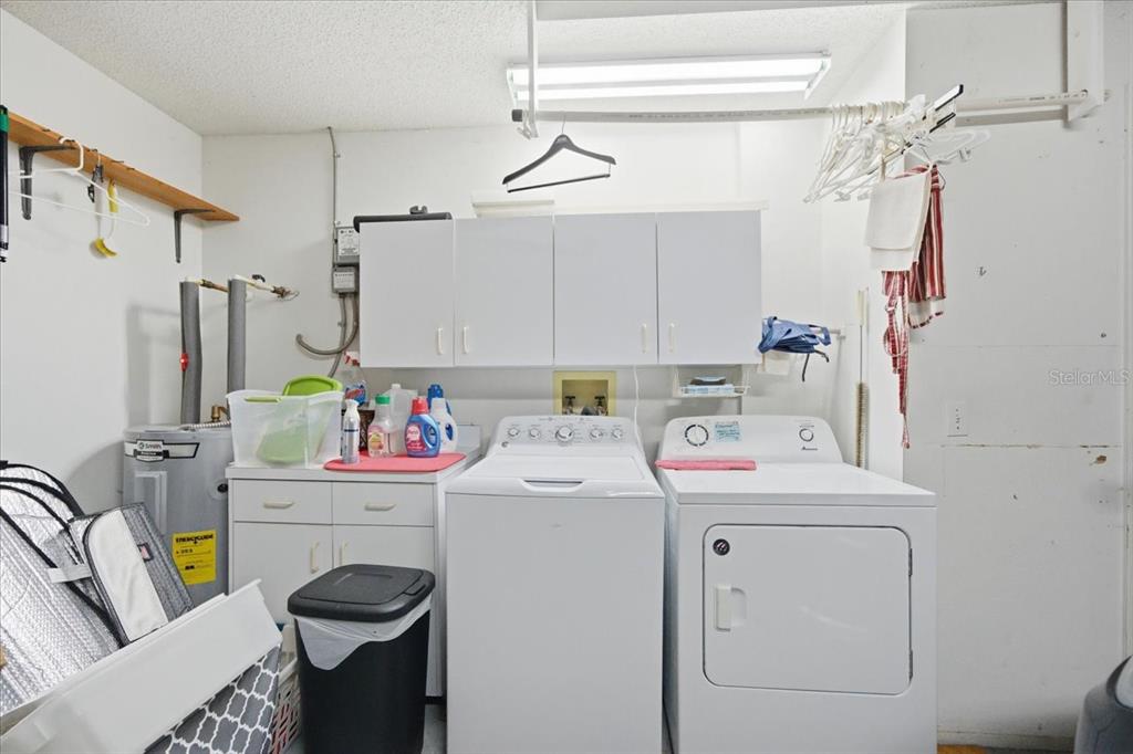 9338 Clearmeadow New Port Richey, FL 34655 - Photo 36 of 54 a utility room with dryer and washer