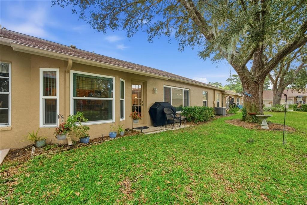 9338 Clearmeadow New Port Richey, FL 34655 - Photo 39 of 54 a front view of a house with garden