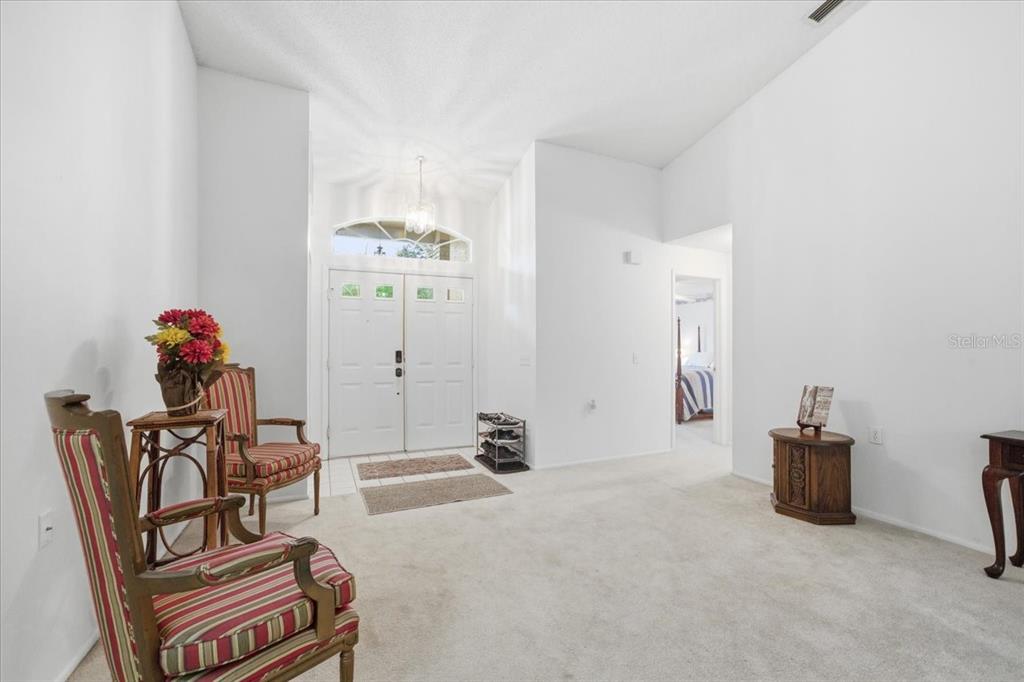9338 Clearmeadow New Port Richey, FL 34655 - Photo 4 of 54 a dining room with furniture and a chandelier