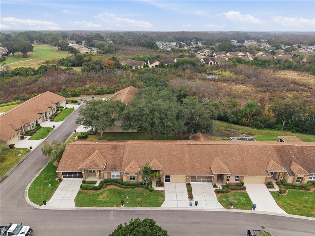 9338 Clearmeadow New Port Richey, FL 34655 - Photo 45 of 54 an aerial view of a house with a garden
