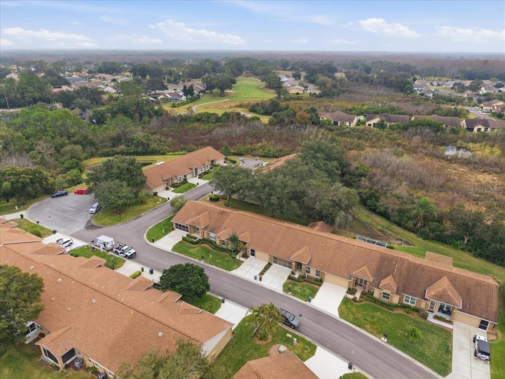 9338 Clearmeadow New Port Richey, FL 34655 - Photo 46 of 54 an aerial view of a city with lots of residential buildings ocean and mountain view in back