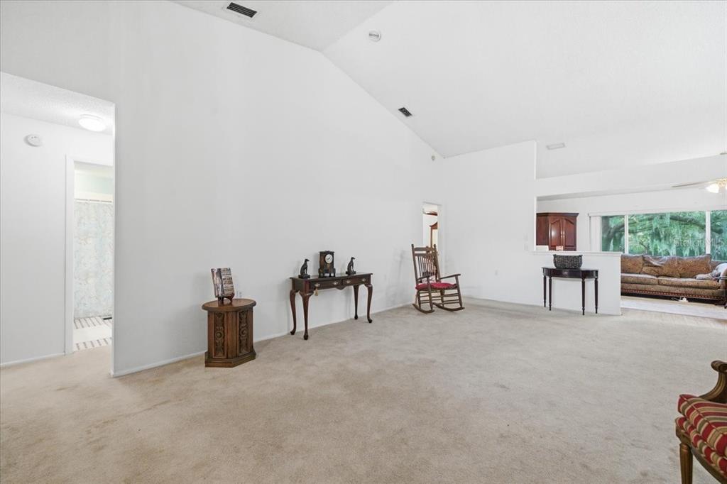 9338 Clearmeadow New Port Richey, FL 34655 - Photo 5 of 54 a view of a livingroom with furniture and a garage