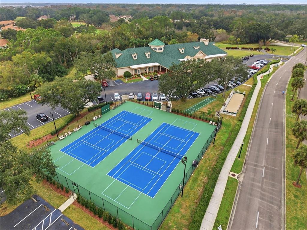 9338 Clearmeadow New Port Richey, FL 34655 - Photo 51 of 54 an aerial view of a tennis ground and a houses