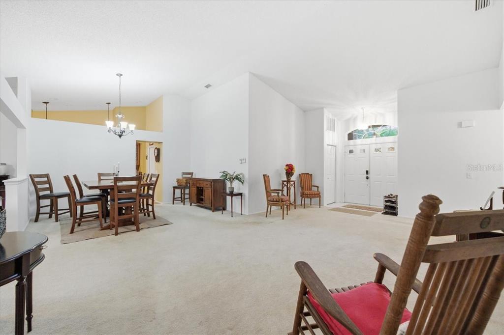 9338 Clearmeadow New Port Richey, FL 34655 - Photo 8 of 54 a dining room with furniture and view kitchen