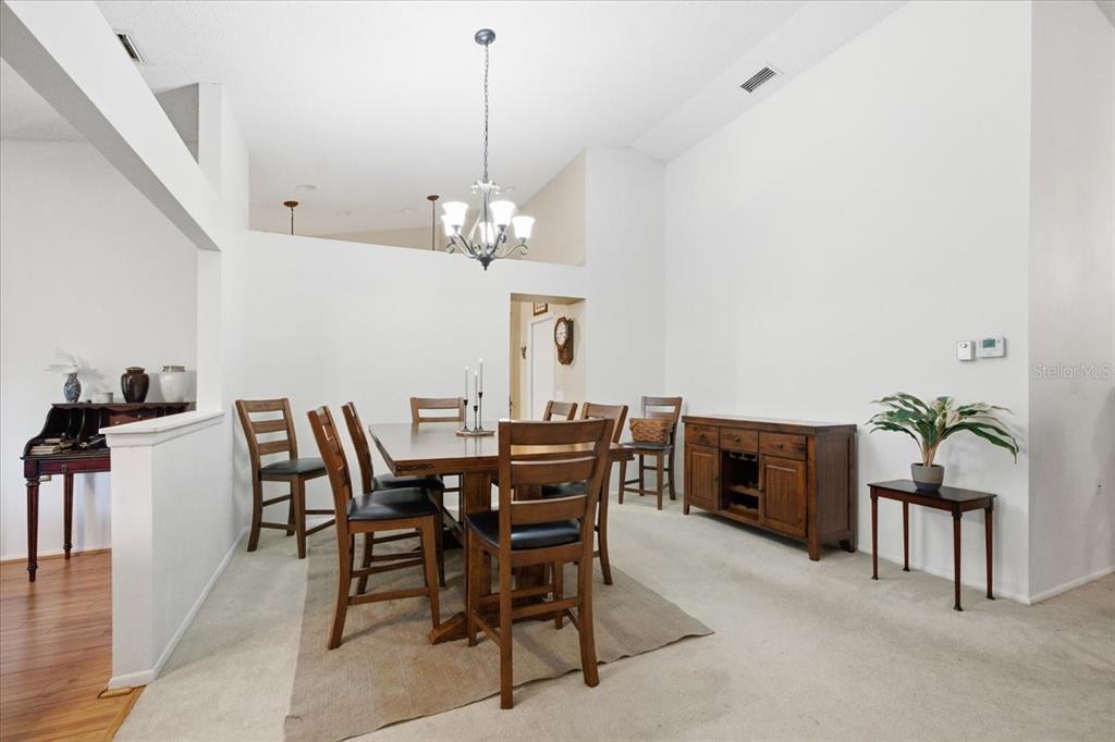 9338 Clearmeadow New Port Richey, FL 34655 - Photo 9 of 54 a view of a dining room with furniture