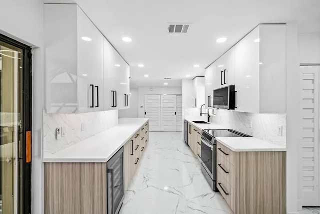 a view of a livingroom with furniture and a window