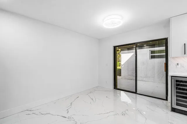 a bathroom with double vanity sink and a mirror