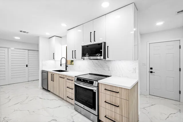 a bathroom with a shower a toilet and sink