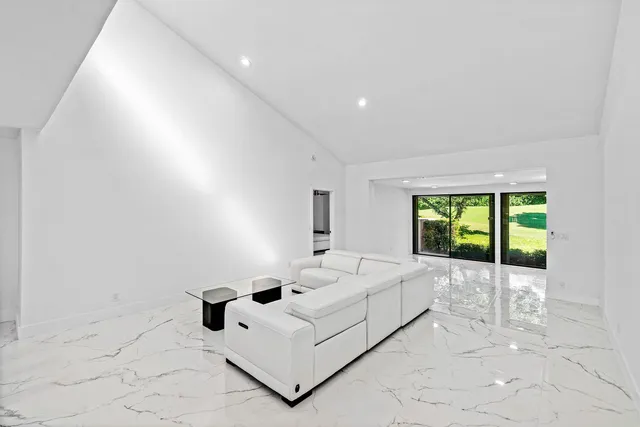 a view of an empty room with a balcony