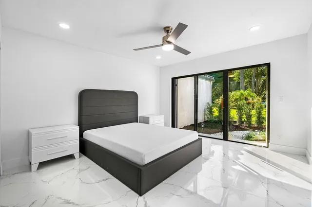 a room with furniture and large window