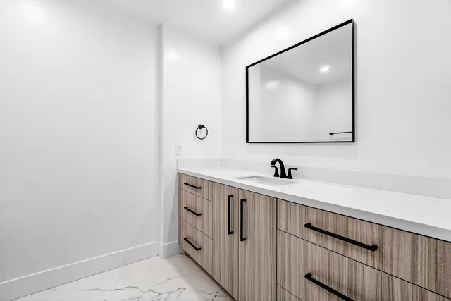 a bedroom with a large bed and a large window