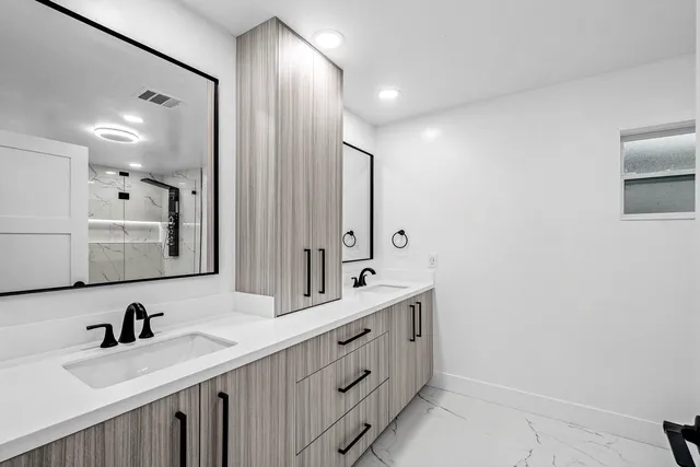 a very nice looking living room with lots of chairs and a table