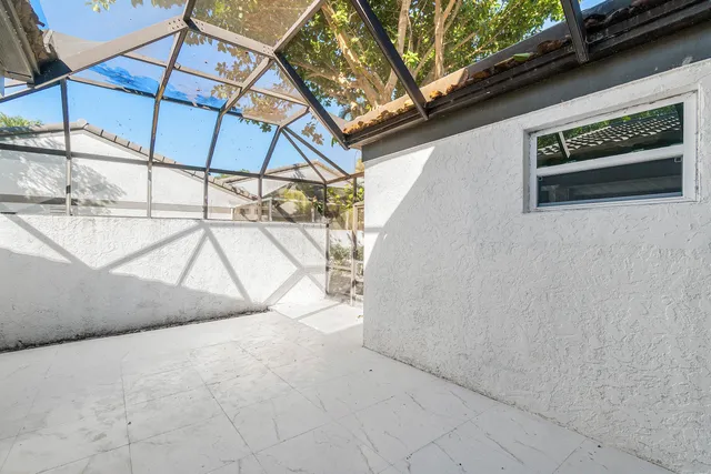 a view of a lake with houses in the back