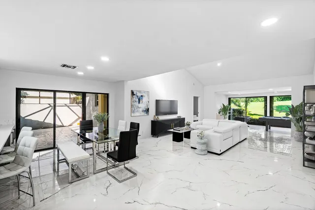 a view of a living room with clothes and shoes