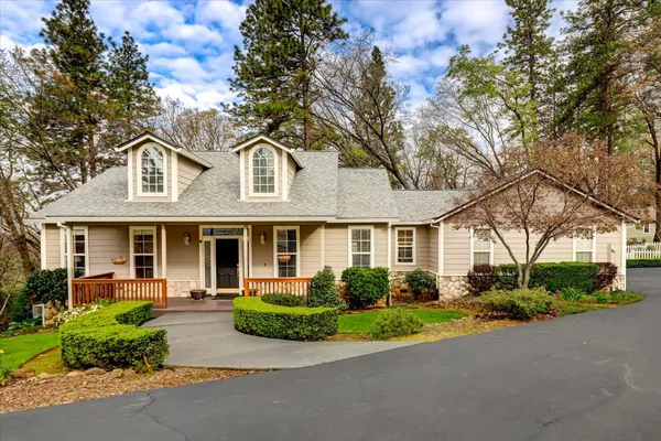front view of a house with a garden