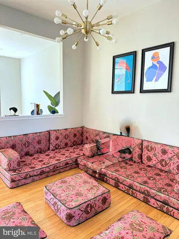 a living room with a bed and a couch