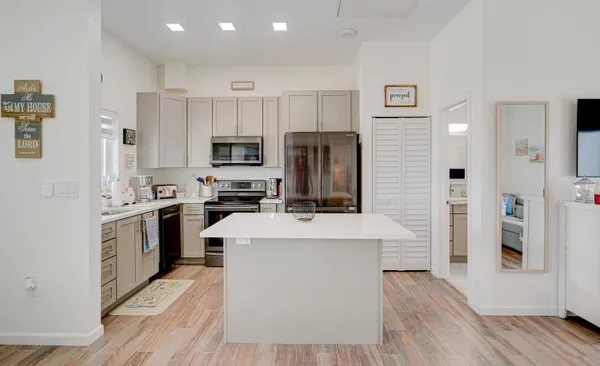 a kitchen with cabinets and stainless steel appliances
