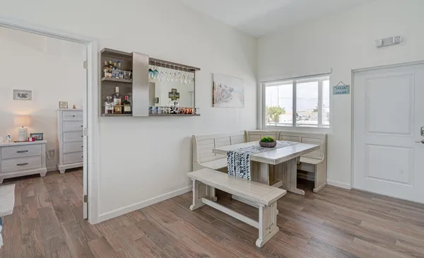 a view of living room filled with furniture and wooden floor