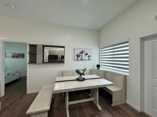 a view of a workspace with furniture