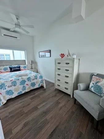 a bedroom with a bed and a couch