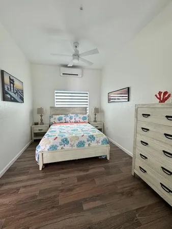 a bedroom with a bed and a dresser