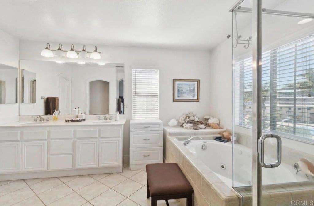 1234 Old Janal Ranch Road Chula Vista, CA 91915 - Photo 31 of 34 a spacious en suite bathroom with double sink and a mirror