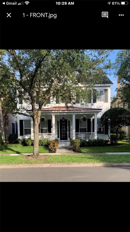 13738 Bluebird Pond Road Windermere, FL 34786 - Photo 1 of 1 a view of a big house with a big yard and potted plants