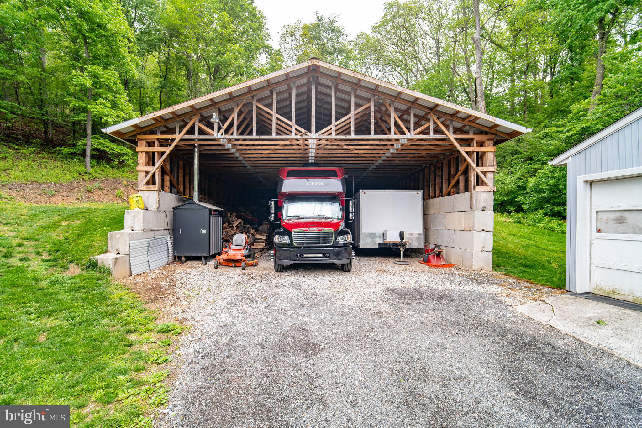 13127 Manor Furnace Road Brogue, PA 17309 - Photo 55 of 78 a view of a wooden house with a small yard and large trees