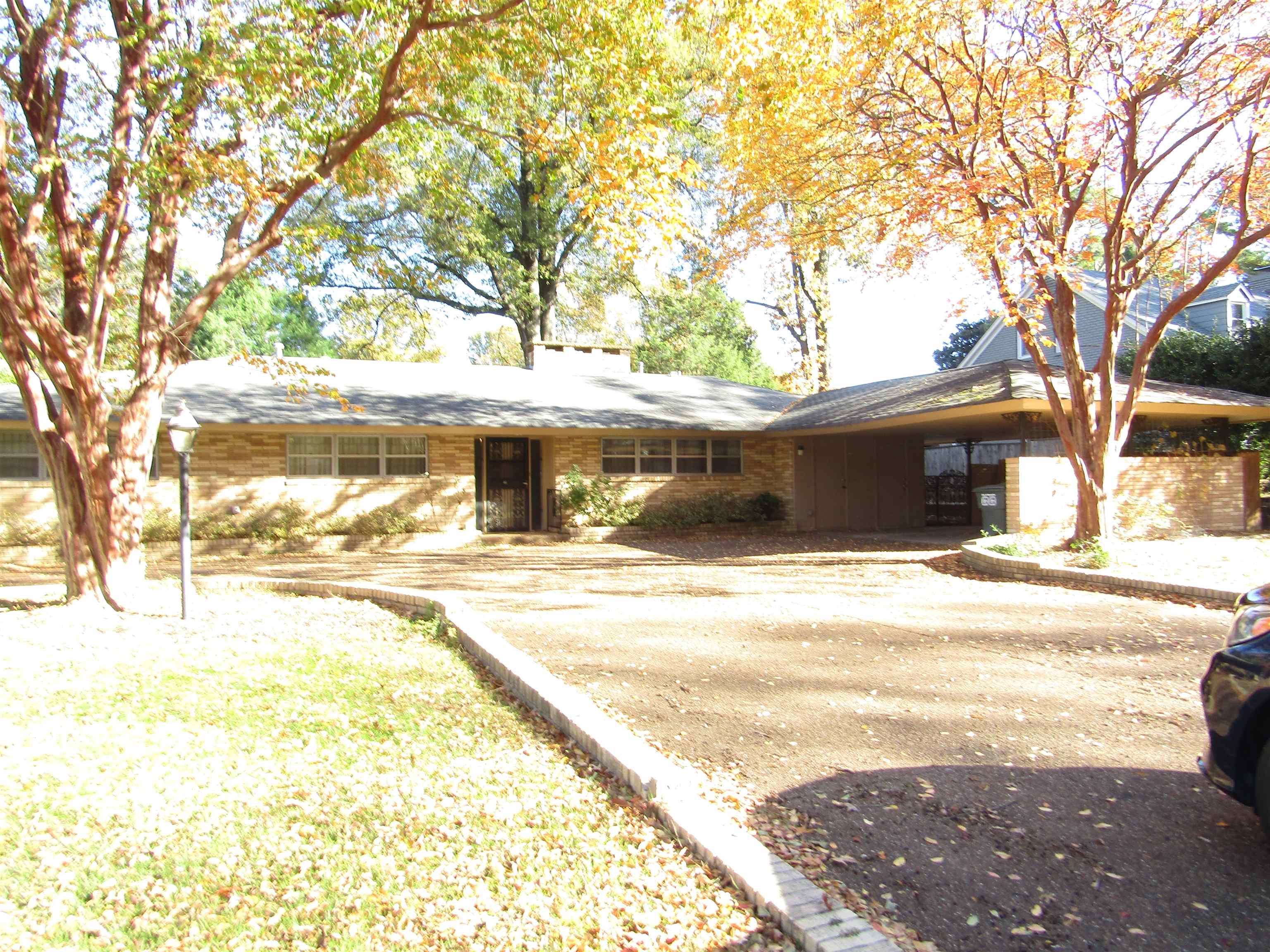 a view of a yard and front view of a house