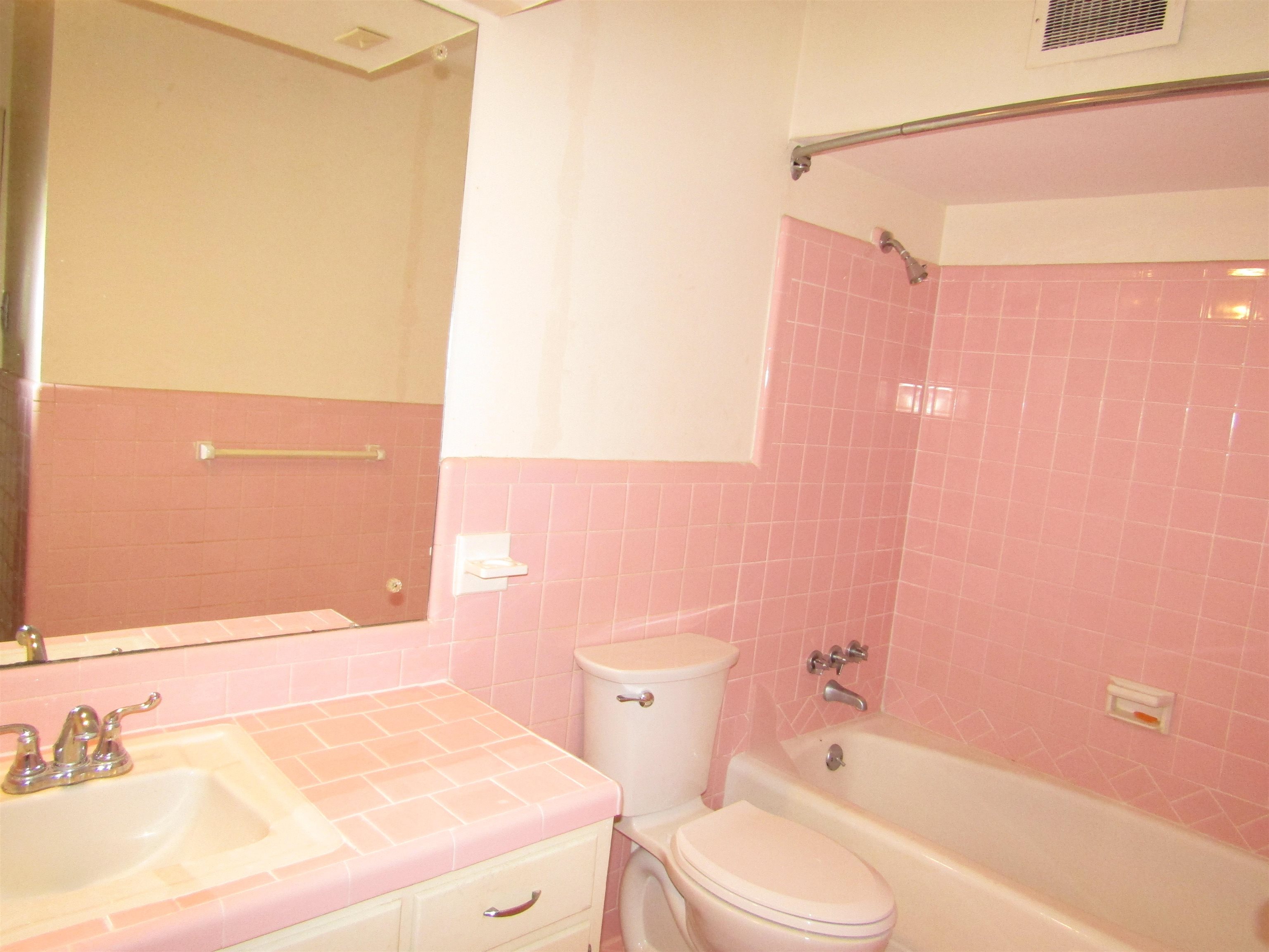244 South Grove Park Road Memphis, TN 38117 - Photo 16 of 16 a bathroom with a sink a toilet and shower