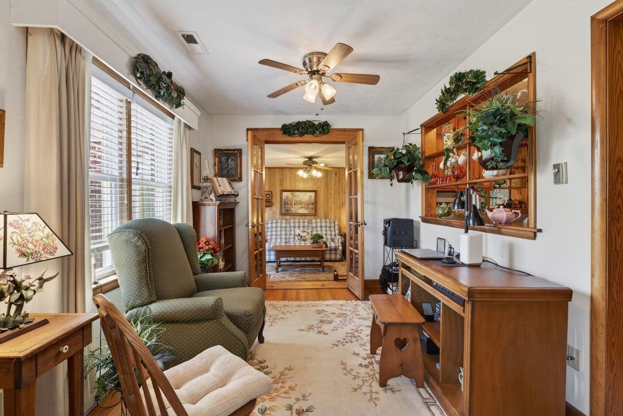 9625 Town Hall Road McGaheysville, VA 22840 - Photo 11 of 65 a living room with furniture a fireplace and a large window