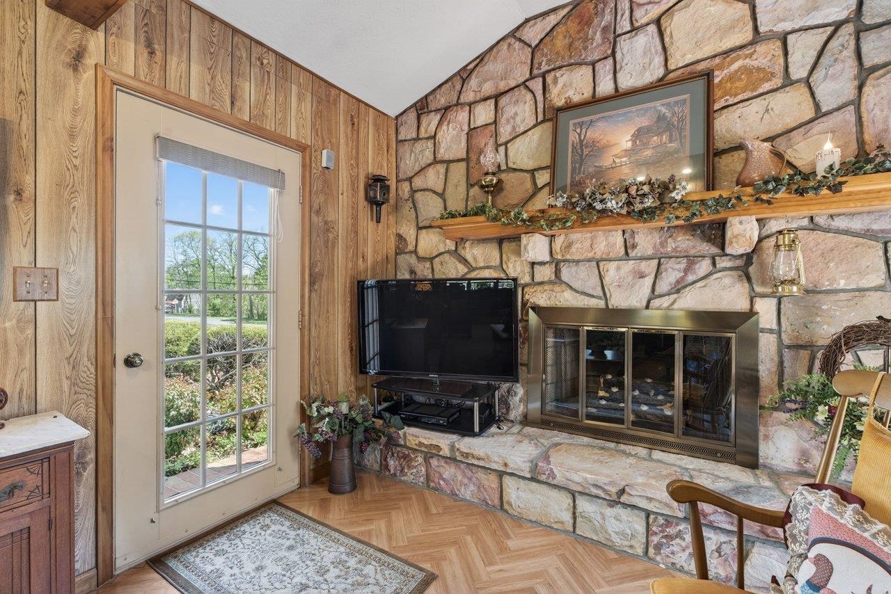9625 Town Hall Road McGaheysville, VA 22840 - Photo 13 of 65 a living room with furniture a flat screen tv and a window