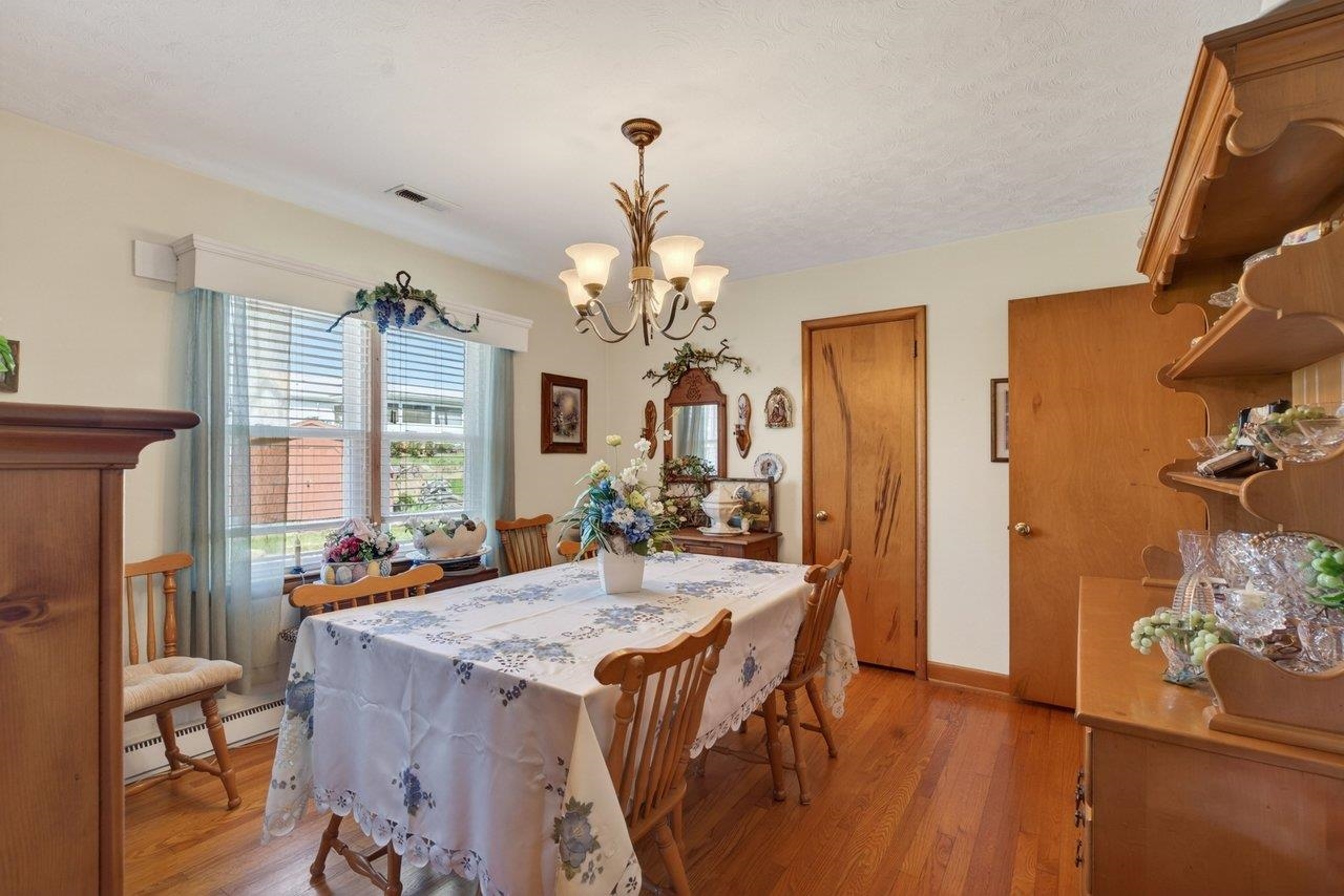 9625 Town Hall Road McGaheysville, VA 22840 - Photo 20 of 65 a view of a dining room with furniture and a chandelier