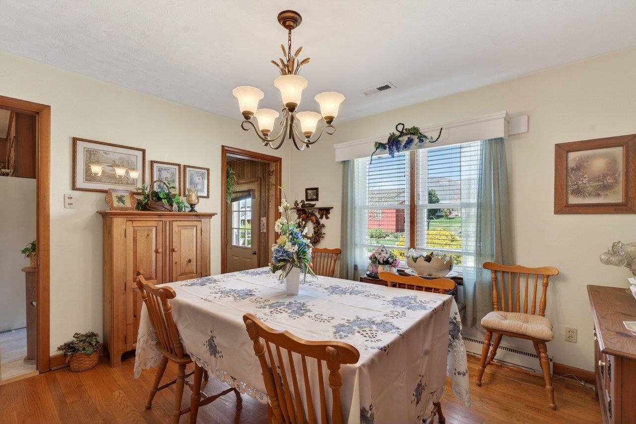 9625 Town Hall Road McGaheysville, VA 22840 - Photo 21 of 65 a view of a dining room with furniture window and wooden floor