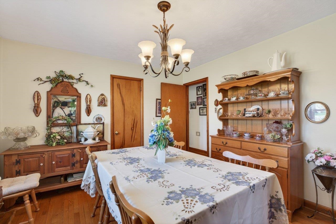 9625 Town Hall Road McGaheysville, VA 22840 - Photo 23 of 65 a view of a dining room with furniture and a chandelier
