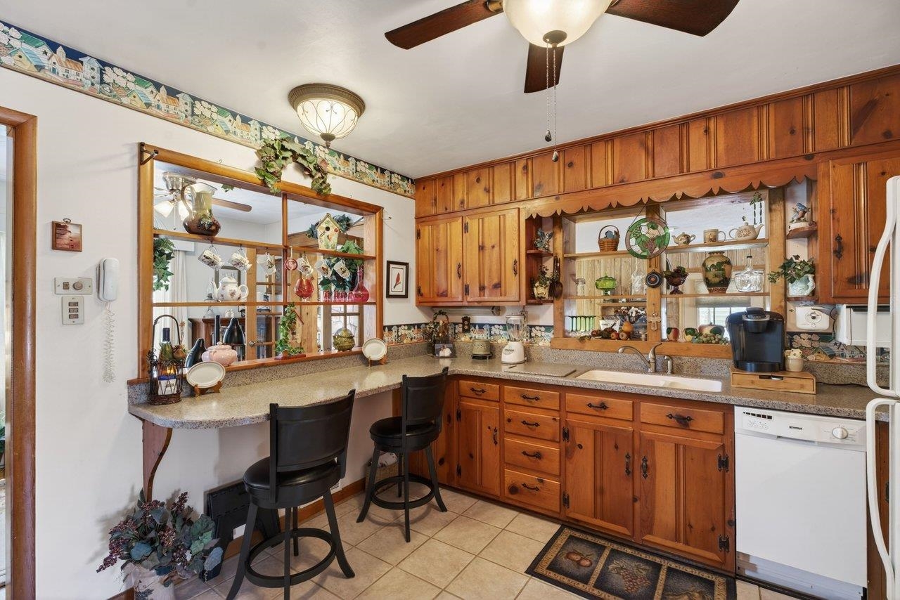 9625 Town Hall Road McGaheysville, VA 22840 - Photo 24 of 65 a kitchen with stainless steel appliances granite countertop a sink and cabinets