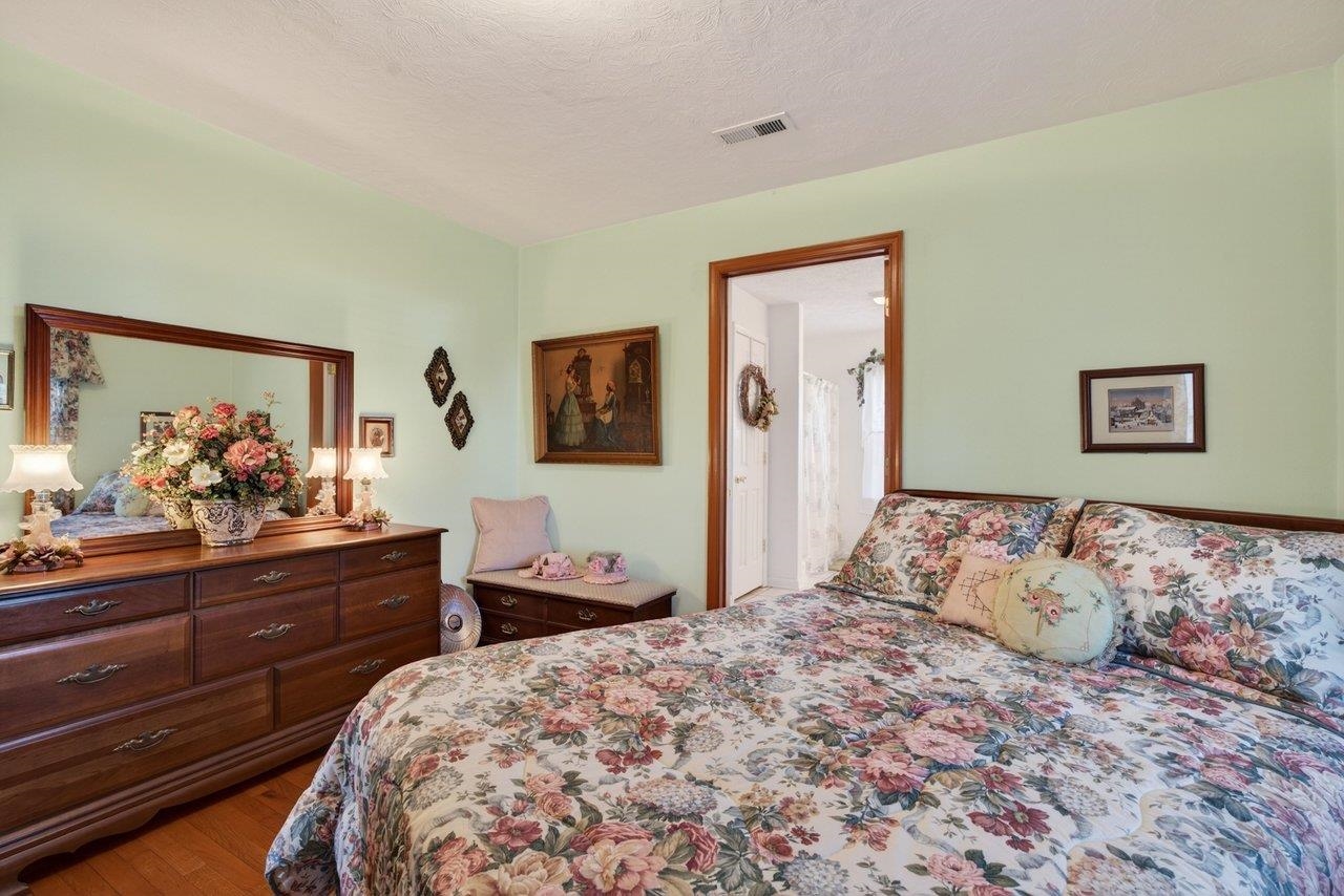 9625 Town Hall Road McGaheysville, VA 22840 - Photo 28 of 65 a bedroom with a bed and a dresser in it