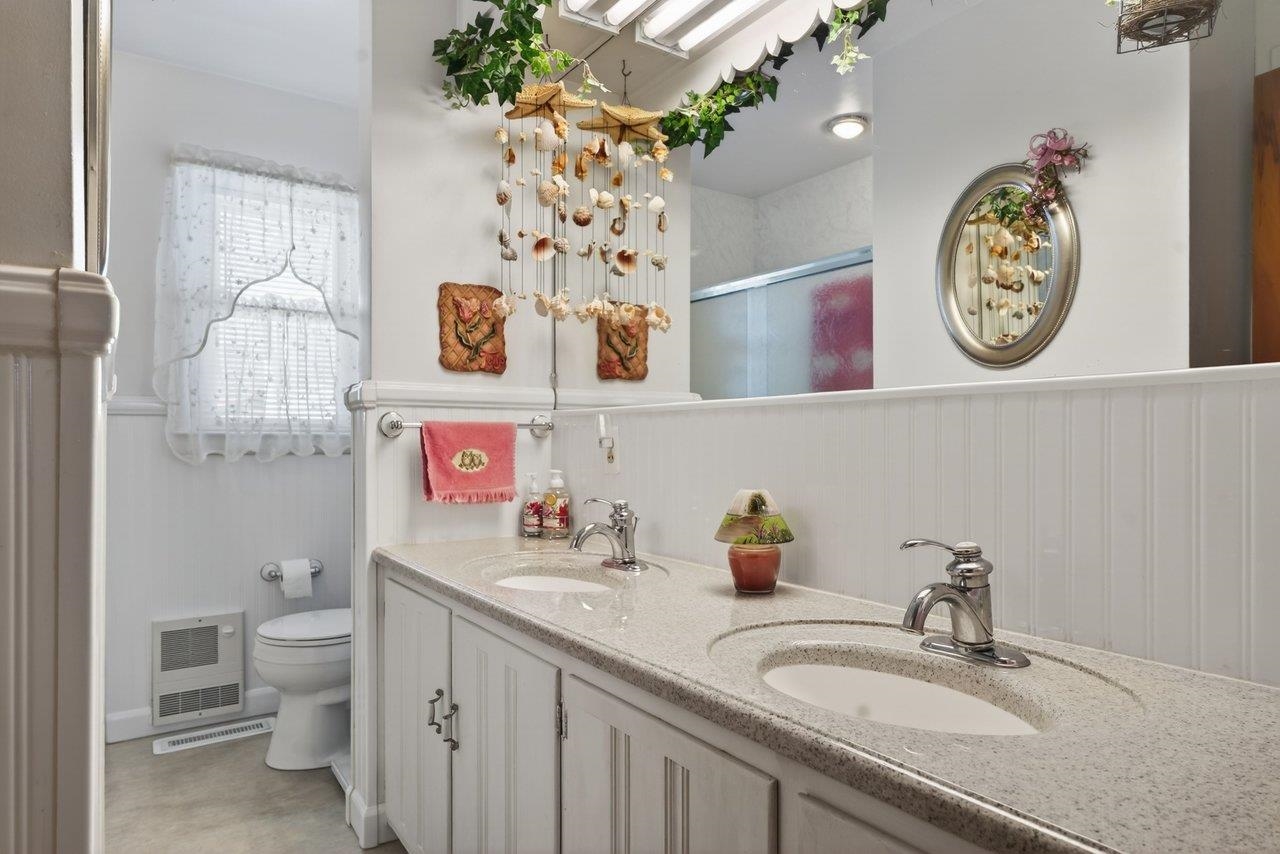 9625 Town Hall Road McGaheysville, VA 22840 - Photo 35 of 65 a bathroom with a sink a toilet and a mirror