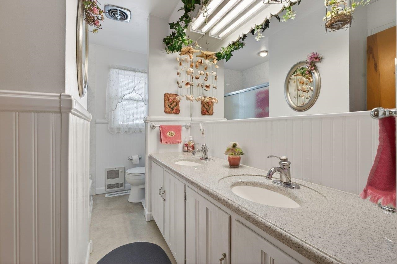 9625 Town Hall Road McGaheysville, VA 22840 - Photo 37 of 65 a bathroom with a sink a vanity and a mirror