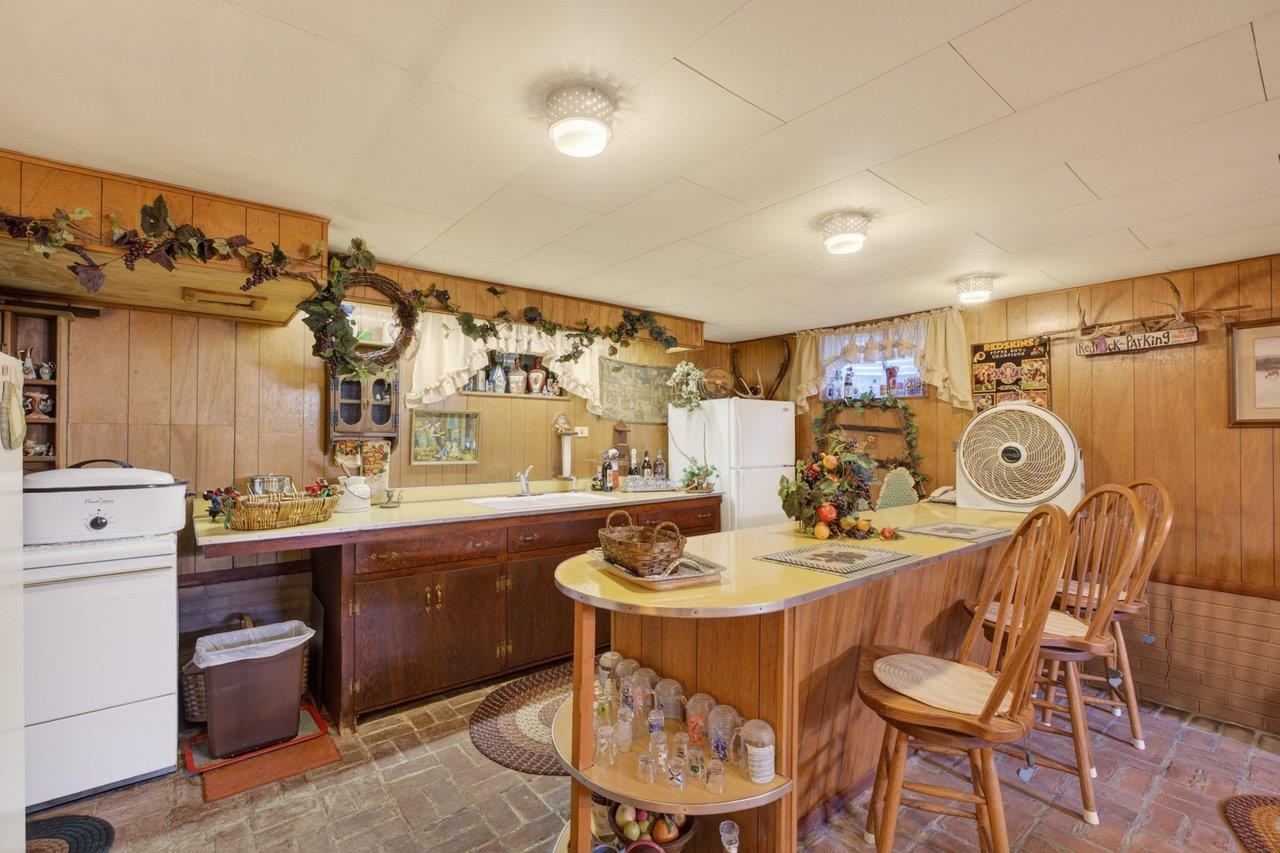 9625 Town Hall Road McGaheysville, VA 22840 - Photo 38 of 65 a dining room with a sink and chairs