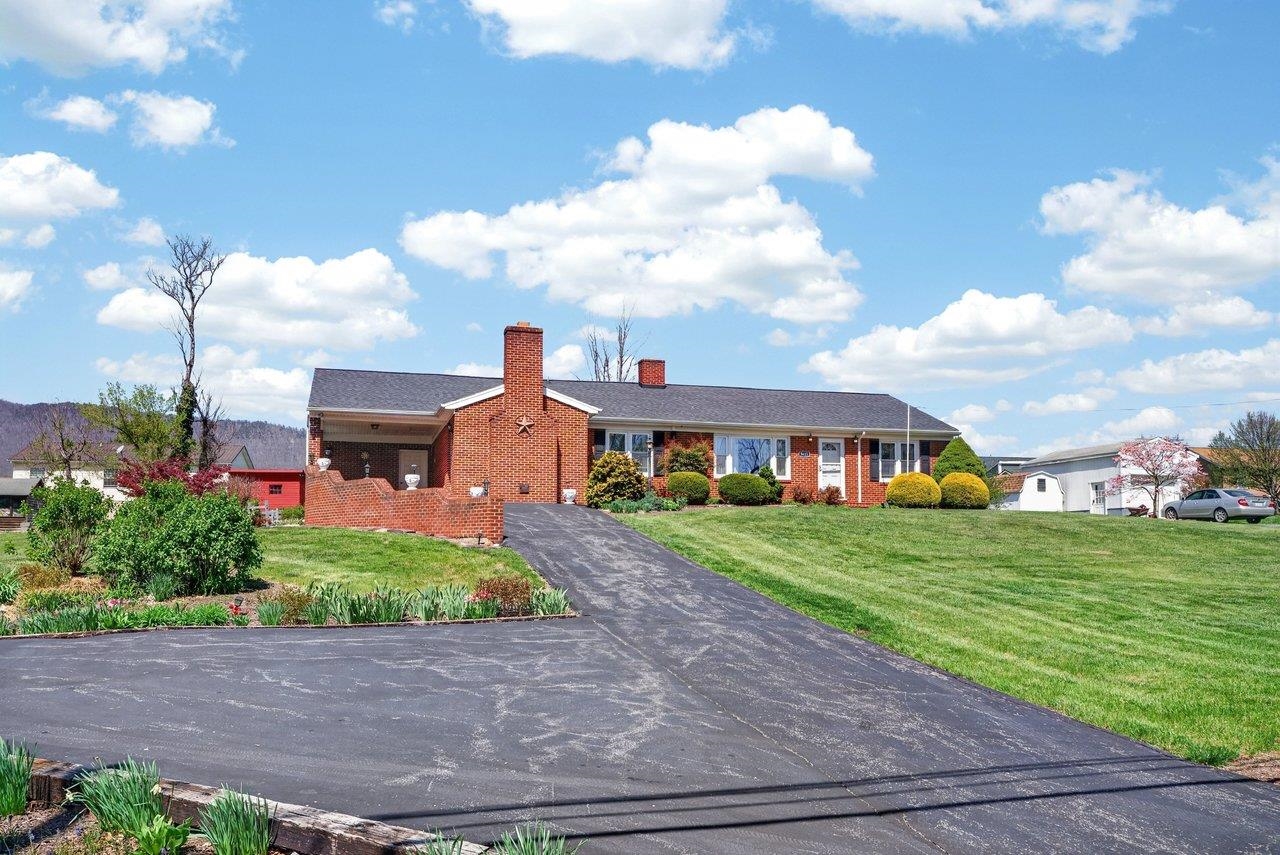 9625 Town Hall Road McGaheysville, VA 22840 - Photo 50 of 65 a front view of a house with a yard and a garage
